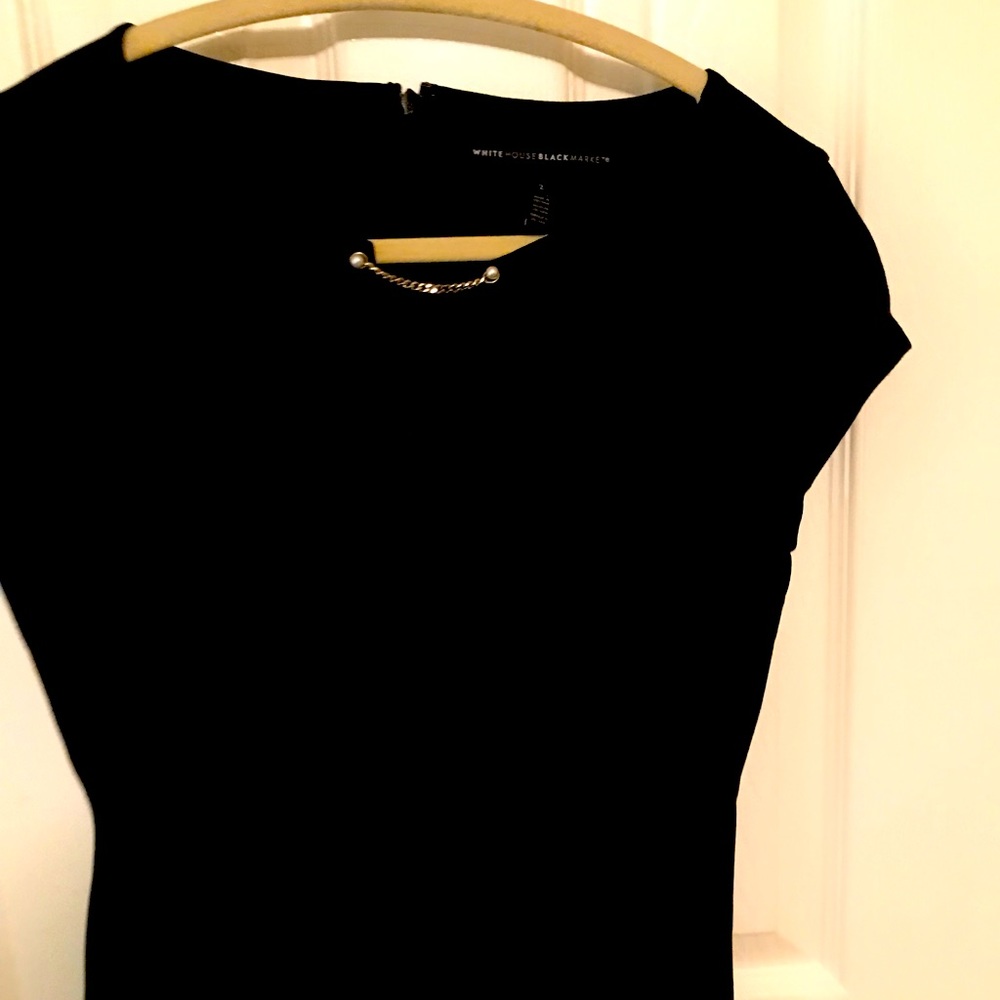 Black top with pearl detail. Great condition!